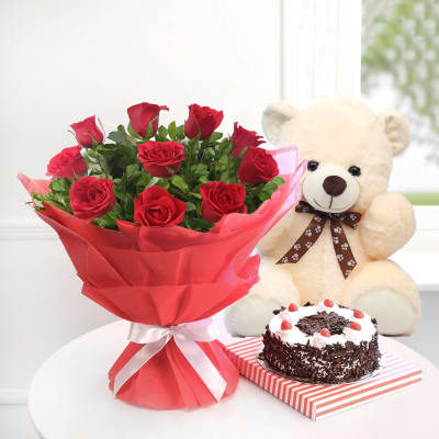 A Bunch of 10 Red Roses with Half Kg Black Forest Cake and Teddy Bear