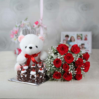 A Bunch of 10 Red Roses with Half Kg Black Forest Cake and Teddy Bear -OZ