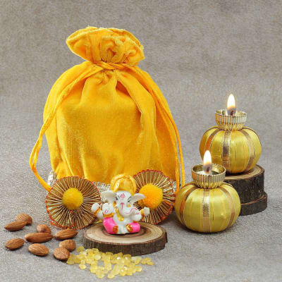 Diyas and Ganesh Idol with Mishri and Almonds