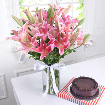 Glass Vase of 10 Pink Lilies with Chocolate Cake (Half Kg)