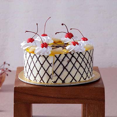 Pineapple Cake with Cherry & Cream Toppings