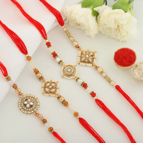 Set of 4 Rakhis With Dry Fruit Sweets